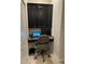 Small home office with desk, chair, and built-in cabinets at 17241 Old Tobacco Rd, Lutz, FL 33558
