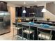 Modern kitchen with dark wood cabinets, granite countertops, and breakfast bar at 17241 Old Tobacco Rd, Lutz, FL 33558