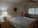 Bedroom with a ceiling fan and queen-size bed at 2003 Greenbriar Blvd # 11, Clearwater, FL 33763