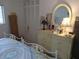 Bright bedroom with a dresser and double bed at 2003 Greenbriar Blvd # 11, Clearwater, FL 33763