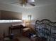 Bedroom with a metal bed frame and ample floor space at 2003 Greenbriar Blvd # 11, Clearwater, FL 33763