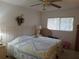 Bedroom with a ceiling fan and queen-size bed at 2003 Greenbriar Blvd # 11, Clearwater, FL 33763