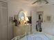 Bright bedroom with dresser, closet and view to another room at 2003 Greenbriar Blvd # 11, Clearwater, FL 33763