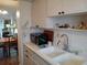 Bright kitchen with double sink and microwave at 2003 Greenbriar Blvd # 11, Clearwater, FL 33763