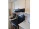 Bright kitchen features ample cabinetry and a full suite of appliances at 2003 Greenbriar Blvd # 11, Clearwater, FL 33763