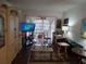 Living room with an entertainment center and balcony view at 2003 Greenbriar Blvd # 11, Clearwater, FL 33763