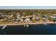Aerial view showcasing a house's waterfront location and surrounding neighborhood at 2834 Coffee Pot Ne Blvd, St Petersburg, FL 33704