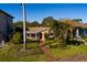 Aerial view of a charming house with a landscaped yard and brick pathway at 2834 Coffee Pot Ne Blvd, St Petersburg, FL 33704