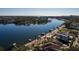 Wide aerial view of a waterfront property with a city skyline in the background at 2834 Coffee Pot Ne Blvd, St Petersburg, FL 33704