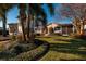 Charming house with lush landscaping, brick walkway, and palm trees at 2834 Coffee Pot Ne Blvd, St Petersburg, FL 33704