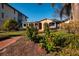 House with lush landscaping, including hibiscus flowers at 2834 Coffee Pot Ne Blvd, St Petersburg, FL 33704