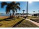 Waterfront view with palm trees and walkway at 2834 Coffee Pot Ne Blvd, St Petersburg, FL 33704
