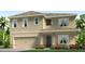 Two-story house with beige exterior, two-car garage, and landscaping at 3321 Ivy Hollow Dr, Plant City, FL 33565