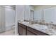 Double vanity bathroom with granite countertop and a shower at 3546 Thistle Bank Ct, Plant City, FL 33565