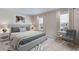 Modern bedroom with a king-size bed and a stylish sitting area at 3546 Thistle Bank Ct, Plant City, FL 33565