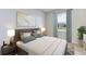 Spacious bedroom with a large bed, neutral walls, and ample natural light at 3546 Thistle Bank Ct, Plant City, FL 33565