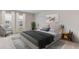 Relaxing bedroom with a king-size bed, comfortable chair, and plenty of light at 3546 Thistle Bank Ct, Plant City, FL 33565