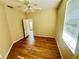Bedroom with wood flooring and access to patio at 4293 Shrimp Ln, North Port, FL 34286