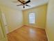 Simple bedroom with wood flooring and ceiling fan at 4293 Shrimp Ln, North Port, FL 34286