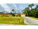 Single-story house with a two-car garage and driveway at 4293 Shrimp Ln, North Port, FL 34286