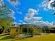 Exterior view showcasing home's back and screened pool area at 4293 Shrimp Ln, North Port, FL 34286