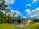 Exterior view of the home, highlighting the backyard and pool at 4293 Shrimp Ln, North Port, FL 34286