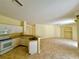 Kitchen with white cabinets, tile floors and breakfast bar at 4293 Shrimp Ln, North Port, FL 34286