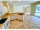 Kitchen with island, appliances, and view to pool at 4293 Shrimp Ln, North Port, FL 34286