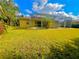 Screened-in pool with lush green backyard at 4293 Shrimp Ln, North Port, FL 34286
