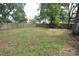 Large grassy backyard with a patio at 619 Glenoak N St, St Petersburg, FL 33703