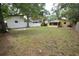 Large backyard with grassy area and privacy fence at 619 Glenoak N St, St Petersburg, FL 33703