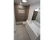Modern bathroom with a walk-in shower and white vanity at 619 Glenoak N St, St Petersburg, FL 33703
