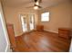 Bedroom with wood floors, french doors, and two nightstands at 619 Glenoak N St, St Petersburg, FL 33703