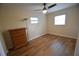 Bedroom with wood floors, dresser, and large window at 619 Glenoak N St, St Petersburg, FL 33703