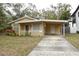 Nice yellow house with carport and small front yard at 619 Glenoak N St, St Petersburg, FL 33703