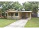 Cute yellow house with carport and a fenced backyard at 619 Glenoak N St, St Petersburg, FL 33703