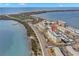 Aerial view of waterfront condo building with parking and boat slips at 7 Elgin Pl # 208, Dunedin, FL 34698