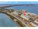 Aerial view of waterfront condo building with surrounding landscape at 7 Elgin Pl # 208, Dunedin, FL 34698