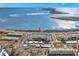Aerial view of waterfront condo building with parking and water access at 7 Elgin Pl # 208, Dunedin, FL 34698