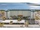Aerial view of a waterfront condo building with parking and beautiful water views at 7 Elgin Pl # 208, Dunedin, FL 34698