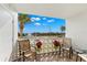 Outdoor balcony with water view and seating at 7 Elgin Pl # 208, Dunedin, FL 34698