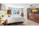 Main bedroom with water view and ample dresser space at 7 Elgin Pl # 208, Dunedin, FL 34698