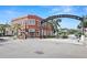 Brick building at corner of street with archway entrance at 7 Elgin Pl # 208, Dunedin, FL 34698
