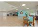 Spacious community room with tiled floors and large windows at 7 Elgin Pl # 208, Dunedin, FL 34698
