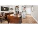 Condo dining area with drop-leaf table and chairs, adjacent to the kitchen at 7 Elgin Pl # 208, Dunedin, FL 34698