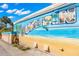 Beach mural with the word 'Dunedin' in large letters at 7 Elgin Pl # 208, Dunedin, FL 34698