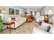 Bright living room with tiled floors and comfy furniture at 7 Elgin Pl # 208, Dunedin, FL 34698