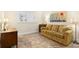 Living room featuring a comfortable sofa and tile flooring at 7 Elgin Pl # 208, Dunedin, FL 34698