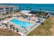 Resort-style pool with plenty of lounge chairs at 7 Elgin Pl # 208, Dunedin, FL 34698
