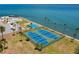 Aerial view of two well-maintained tennis courts at 7 Elgin Pl # 208, Dunedin, FL 34698